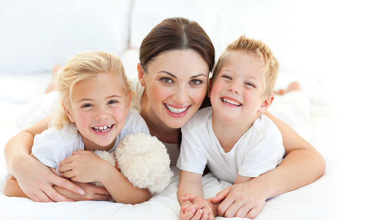 A happy mother smiling with her children